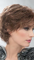 This sophisticated style features all-over layers, soft body, and curls