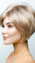 A short, multilayered wig with side swept fringe